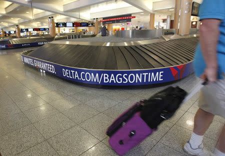 The Delta baggage area of the terminal is empty after Delta Air Lines' computer systems crashed on Monday, grounding flights around the globe, at Hartsfield Jackson Atlanta International Airport in Atlanta, Georgia, U.S. August 8, 2016. REUTERS/Tami Chappell