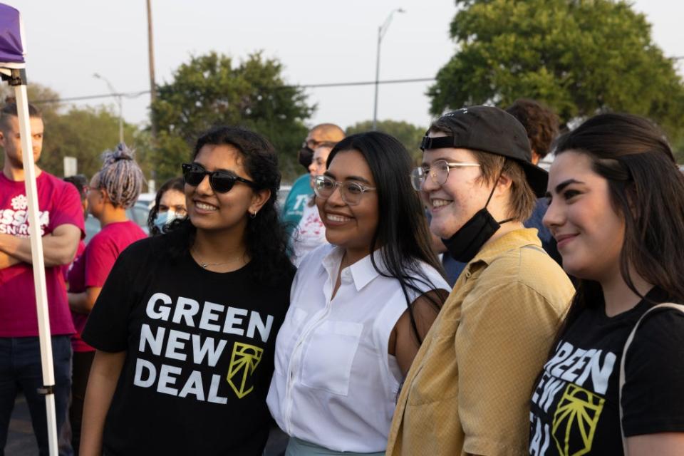 Progressive Democratic Congressional candidate Jessica Cisneros poses for photos with supporters at a nearby polling location after a campaign rally on May 20, 2022 in San Antonio, Texas. (Getty Images)