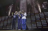 Medalists in the women's pole vault Anzhelika Sidorova, who participates as a neutral athlete, gold, center, Sandi Morris of the United States, silver, left, and Katerina Stefanidi of Greece, bronze, pose during the medal ceremony at the World Athletics Championships in Doha, Qatar, Monday, Sept. 30, 2019. (AP Photo/Nariman El-Mofty)