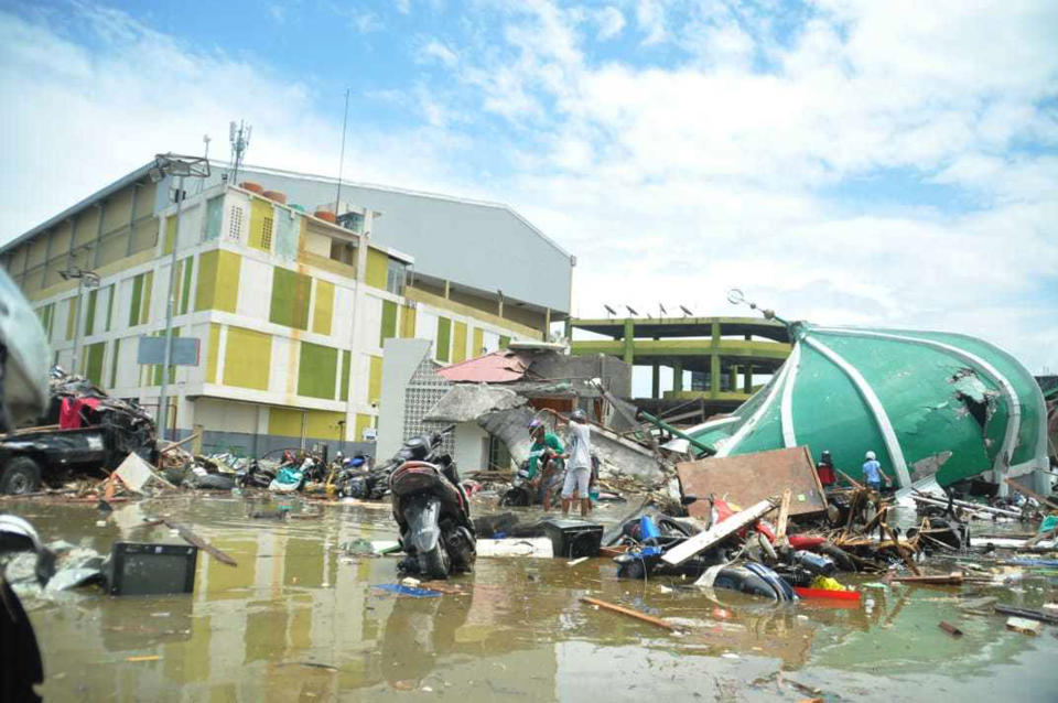 Huge areas of Palu were reduced to rubble following the deadly tsunami. Image: AAP