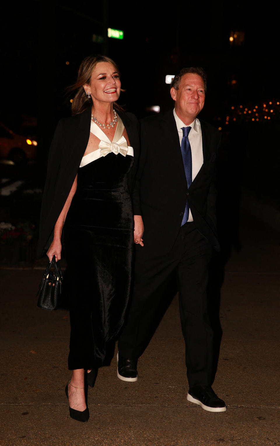 Savannah Guthrie walks side by side with husband Mike Feldman