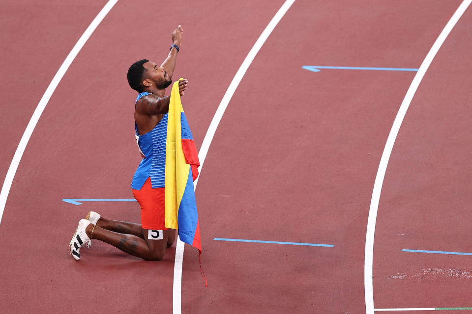 Colombian runner Anthony Jose Zambrano celebrates placing in Men's 400 meter