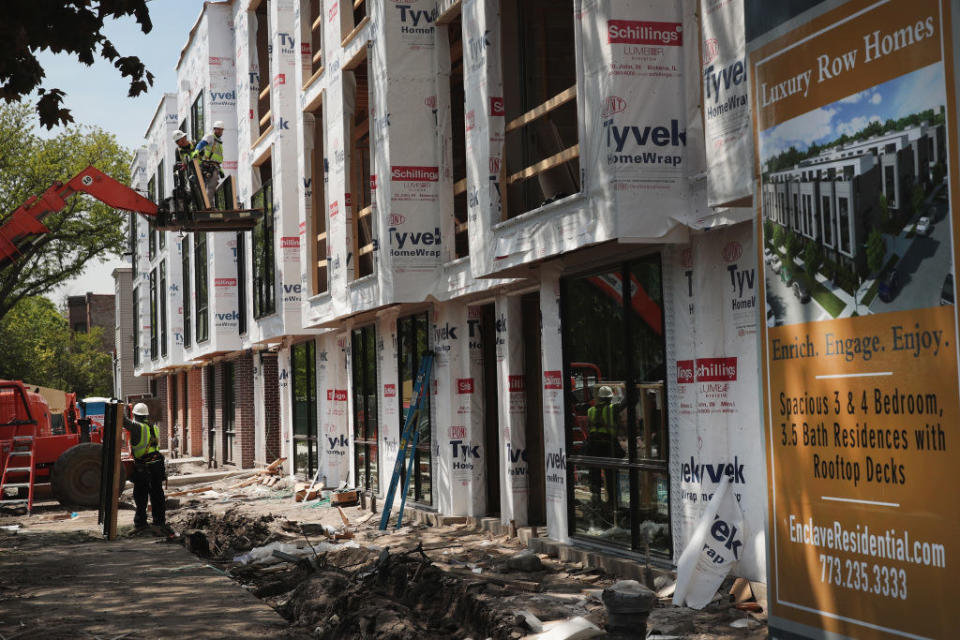 Workers building new luxury row homes in Chicago
