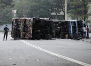 FILE PHOTO: Sri Lanka's ruling party supporters storm anti-government protest camp in Colombo