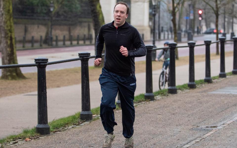 Health Secretary Matt Hancock jogs through Green Park this morning - Joshua Bratt