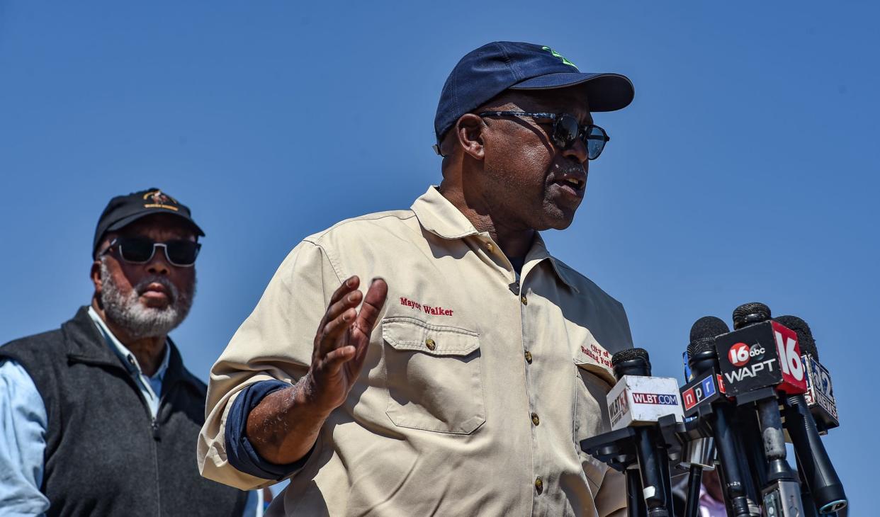 Eldridge Walker, the mayor of Rolling Fork as well as a local funeral director, speaks alongside Benny Thompson following Friday's deadly tornado in Rolling Fork, Miss., Sunday, March 26, 2023.