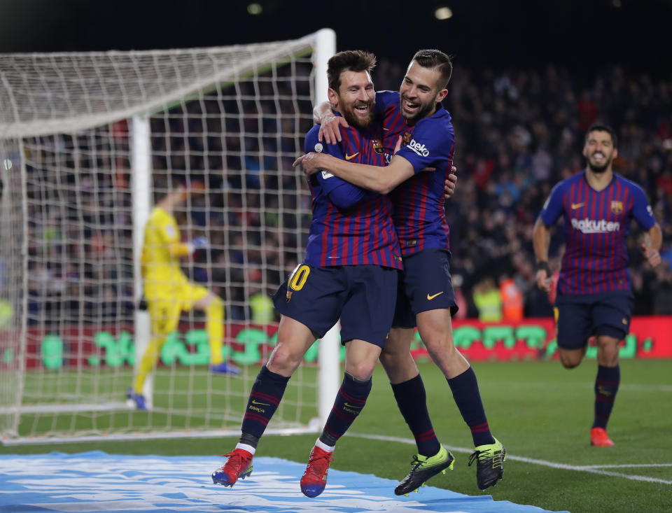 FC Barcelona's Lionel Messi, left, celebrates with his teammate Jordi Alba after scoring during the Spanish La Liga soccer match between FC Barcelona and Leganes at the Camp Nou stadium in Barcelona, Spain, Sunday, Jan. 20, 2019. (AP Photo/Manu Fernandez)