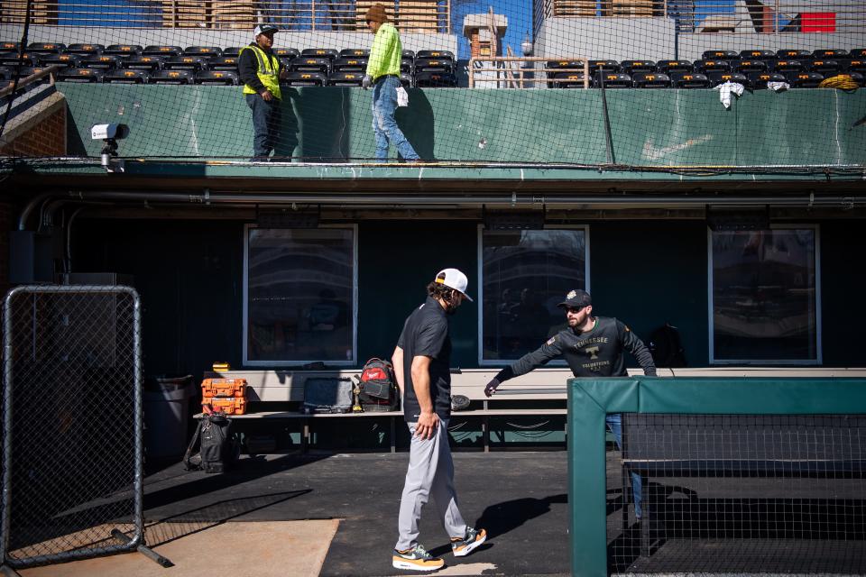 Tennessee baseball coach Tony Vitello, bottom center with white hat, examines material that may be used for the home dugout benches while renovation work continues at Lindsey Nelson Stadium on the University of Tennessee campus in Knoxville on Tuesday, February 6, 2024.