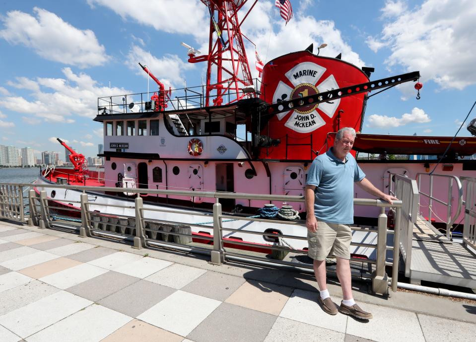 David Rocco of Yorktown, a member of board of directors of the Fireboat McKean Preservation Project, stands near the the retired NYFD fireboat in lower Manhattan June 24, 2021. The fireboat was involved in fighting the fires at the World Trade Center during the attacks of Sept. 11, 2001, as well as assisting helping to keep Capt. Sullenberger's Miracle on the Hudson plane afloat in January of 2009. The boat had been recently been docked in Tarrytown.