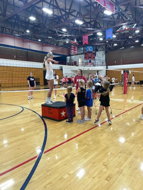 BNL senior Hayley Davis (on podium) teachers proper hitting technique to grade-school kids during the BNL Stars Camp this week.