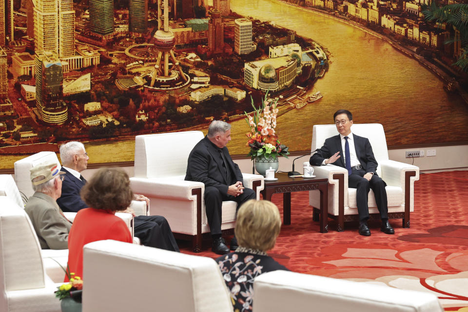 FILE - Chinese Vice President Han Zheng, right, talks to Jeffrey Greene, chairman of the Sino-American Aviation Heritage Foundation during a meeting with two US World War II veterans Harry Moyer, second far left, and Mel McMullen, left, at the Great Hall of the People in Beijing on Oct. 30, 2023. (Ding Haitao/Xinhua via AP, File)