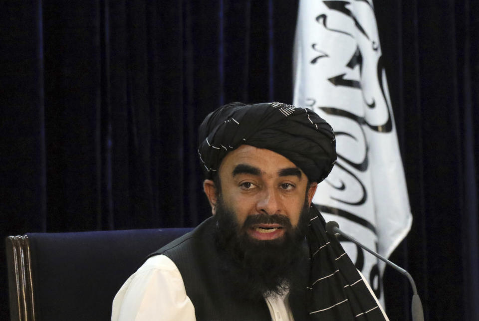 Taliban spokesman Zabihullah Mujahid speaks during a press conference in Kabul, Afghanistan Tuesday, Sept. 7, 2021. The Taliban on Tuesday announced a caretaker Cabinet stacked with veterans of their harsh rule in the late 1990s and subsequent 20-year battle against the U.S.-led coalition and its Afghan government allies. The line-up announced at the press conference is not likely to win the international support the Taliban so desperately need to avoid an economic meltdown. (AP Photo/Muhammad Farooq)