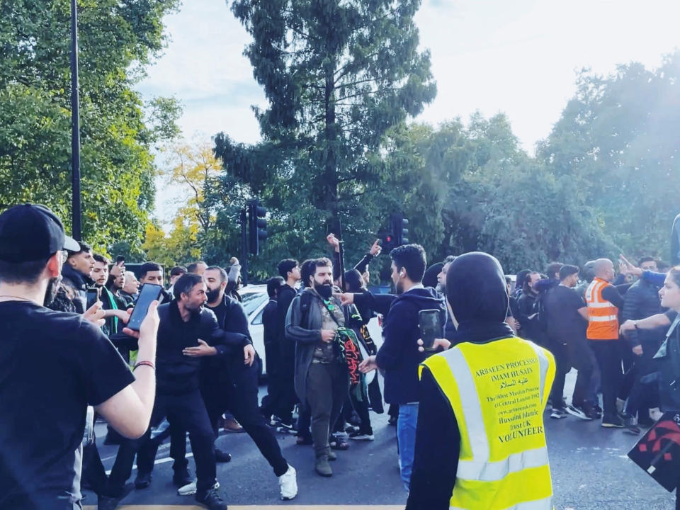 Protesters clash during demonstrations following the death of Mahsa Amini in Iran, in London, Britain September 25, 2022 in this screen grab obtained from social media video. Twitter @PaulBrown_UK/via REUTERS  THIS IMAGE HAS BEEN SUPPLIED BY A THIRD PARTY. MANDATORY CREDIT.