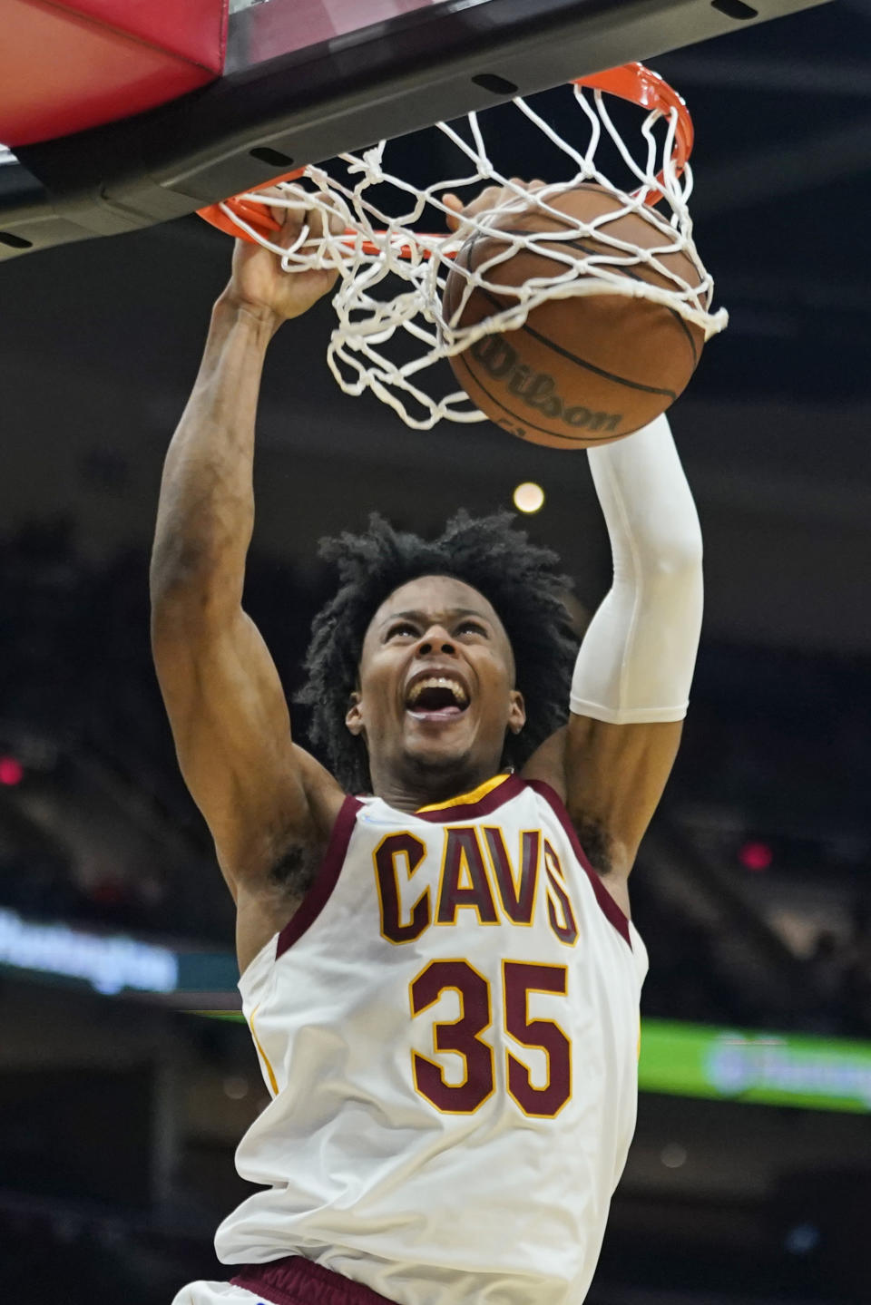 Cleveland Cavaliers' Isaac Okoro dunks the ball against the Orlando Magic in the second half of an NBA basketball game, Saturday, Nov. 27, 2021, in Cleveland. The Cavaliers won 105-92. (AP Photo/Tony Dejak)