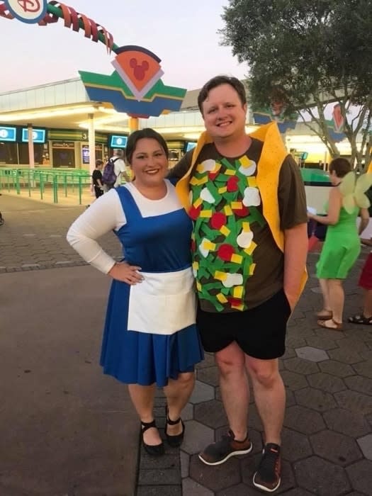 A woman dressed as Belle from "Beauty and the Beast" and a man dressed as a taco