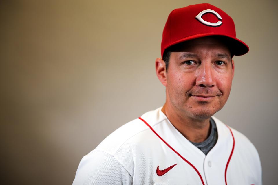 Cincinnati Reds associate coach Rolando Valles (88) stands for a portrait, Wednesday, Feb. 19, 2020, at the baseball team's spring training facility in Goodyear, Ariz. 