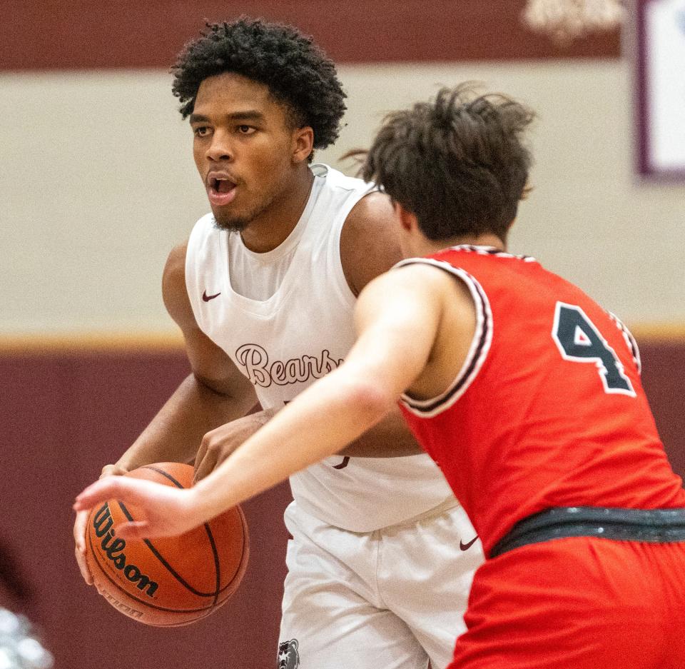 Jacob Franklin (5) of Lawrence Central High School  controls a ball against Ben Wilkerson (4) of Park Tudor High School, Wednesday, Jan. 4, 2023, during a game won by Lawrence Central 72-67, at LCHS. 