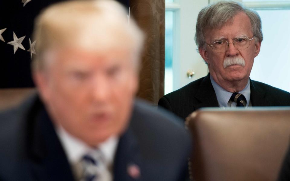 Former national security adviser John Bolton has spoken out against his old boss - SAUL LOEB /AFP