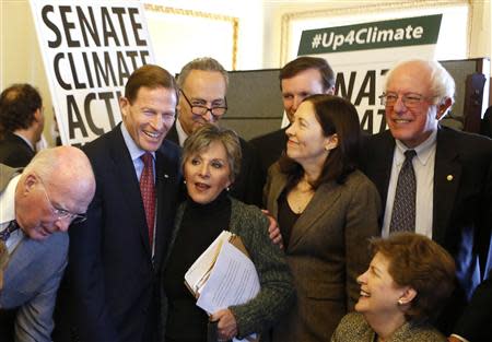 U.S. Senators from the Senate Climate Action Task Force gather before holding the Senate floor to urge action on climate change, on Capitol Hill in Washington March 10, 2014. REUTERS/Yuri Gripas