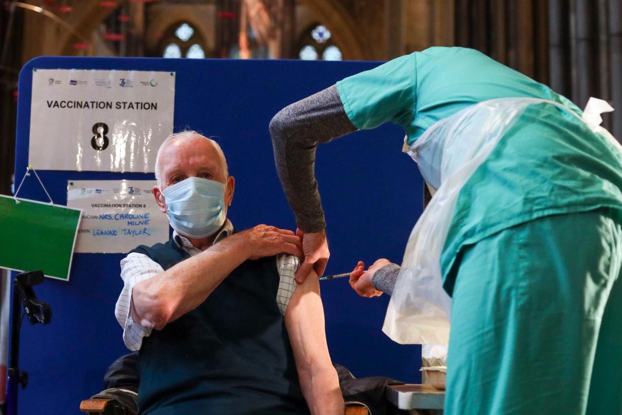 <p>Former RAF Flight Sergeant Louis Godwin receives a Pfizer coronavirus vaccine shot at Salisbury Cathedral</p> (PA)