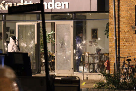 Forensic investigators are seen at the site of a shooting in Copenhagen February 14, 2015. REUTERS/Mathias Oegendal/Scanpix Denmark