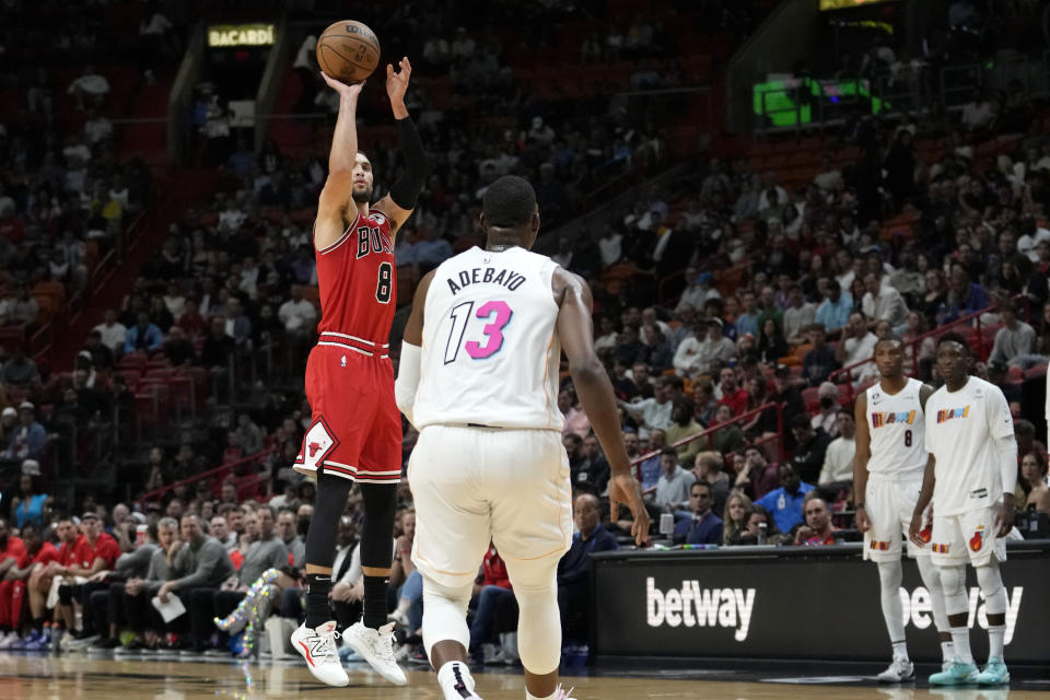Chicago Bulls guard Zach LaVine (8) attempts a three-point basket during the first half of an NBA basketball game against the Miami Heat, Tuesday, Dec. 20, 2022, in Miami. (AP Photo/Lynne Sladky)