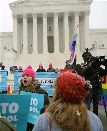 Demonstrators gather in front of the U.S. Supreme Court for the "Not My Boss's Business" rally for women's health and rights in Washington March 25, 2014. REUTERS/Gary Cameron