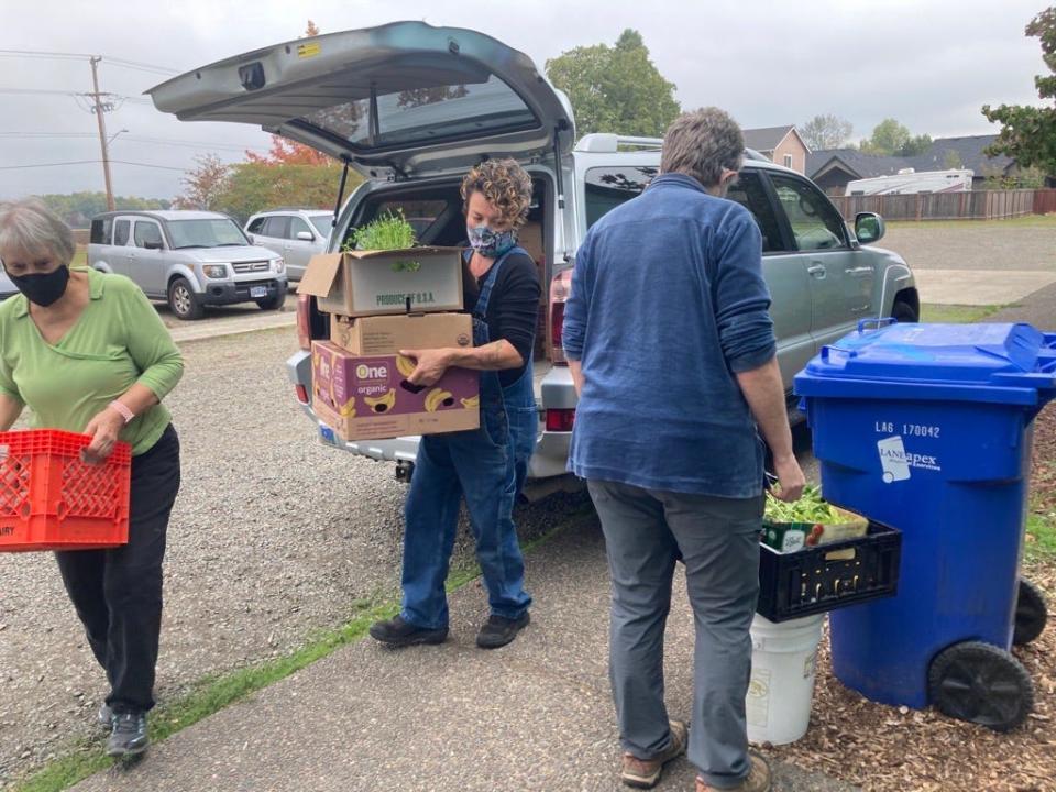 Burrito Brigade members assemble their free grocery store, the Waste to Taste Food Rescue program, in 2021. The organization has been awarded a grant from the A Community Thrives program.