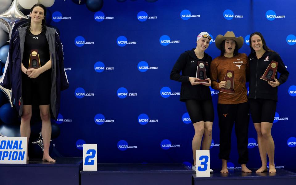 Thomas (left) atop the podium as fellow competitors Emma Weyant, Erica Sullivan and Brooke Forde pose for a photo - GETTY IMAGES