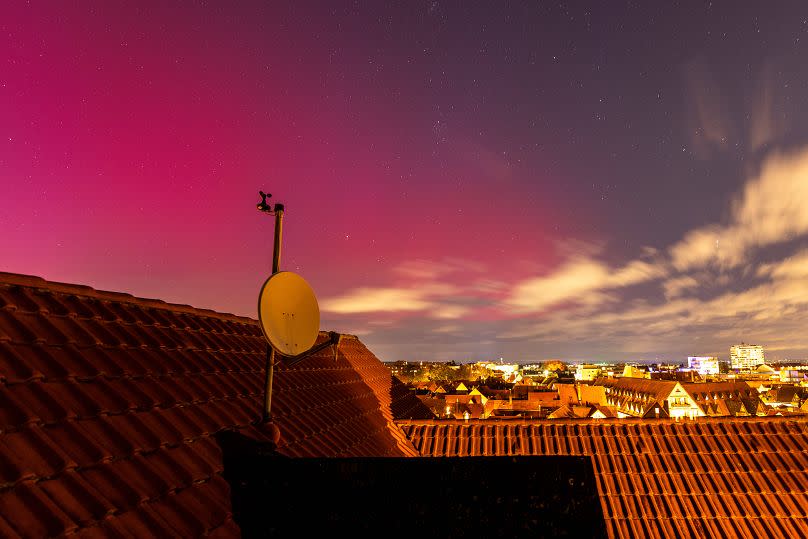 Northern lights can be seen in the evening in the sky over Oberursel, Hesse, Germany.