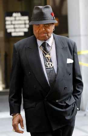 FILE PHOTO: Joe Jackson, father of the late pop star Michael Jackson, leaves the courthouse during Dr. Conrad Murray's trial in the death of his son in Los Angeles, California, U.S., September 28, 2011. REUTERS/Mario Anzuoni/File Photo