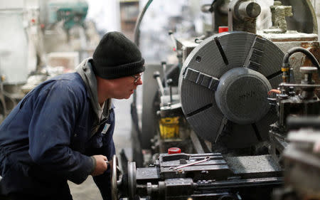 Kays Factory worker Robert Holt operates a lathe to make a curling stone in Mauchline, Scotland, Britain, January 11, 2018. REUTERS/Russell Cheyne