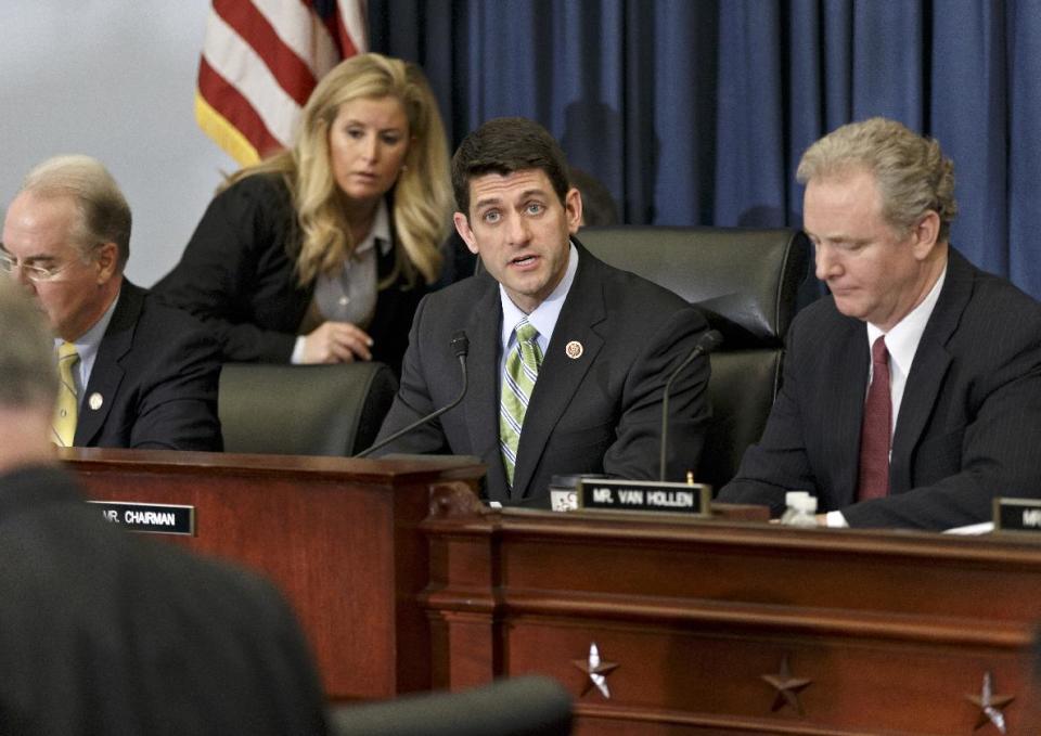 House Budget Committee Chairman Rep. Paul Ryan, R-Wis., center, presides over a markup session where House Republicans are crafting a budget-balancing plan that sharply cuts spending on transportation, health care programs for the middle class and the poor, food stamps and other domestic initiatives, Wednesday, April 2, 2014, on Capitol Hill in Washington. Ryan is flanked by Rep. Chris Van Hollen, D-Md., right, the committee's ranking member, and Rep. Tom Price, R-Ga., left. (AP Photo/J. Scott Applewhite)