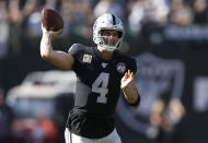 Oakland Raiders quarterback Derek Carr (4) looks to pass against the Detroit Lions during the first half of an NFL football game in Oakland, Calif., Sunday, Nov. 3, 2019. (AP Photo/D. Ross Cameron)