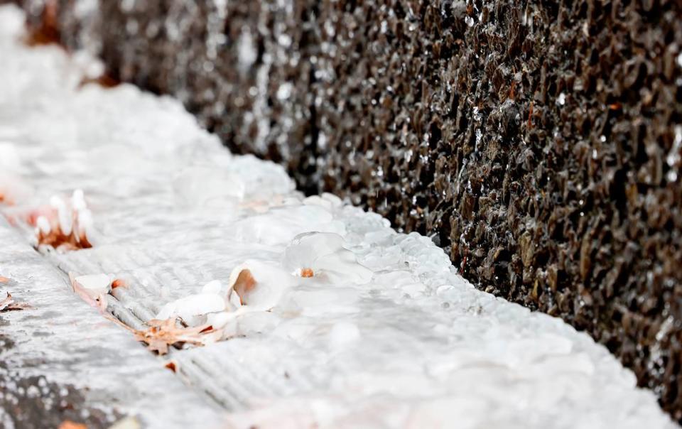 Water from a fountain outside of AT&T Stadium is frozen during a Winter Weather Advisory on Sunday, January 14, 2024, in Arlington.