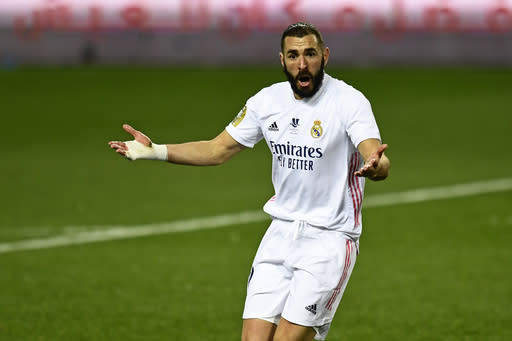 Real Madrid's Karim Benzema gestures during Spanish Super Cup semi final soccer match between Real Madrid and Athletic Bilbao at La Rosaleda stadium in Malaga, Spain, Thursday, Jan. 14, 2021. Athletic Bilbao won 2-1 and will play the final. (AP Photo/Jose Breton)