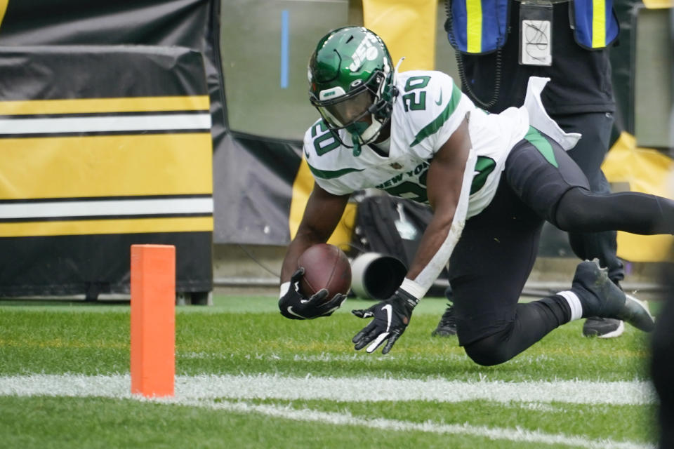 New York Jets running back Breece Hall (20) goes out of bounds before making it into the end zone against the Pittsburgh Steelers during the first half of an NFL football game, Sunday, Oct. 2, 2022, in Pittsburgh. (AP Photo/Gene J. Puskar)