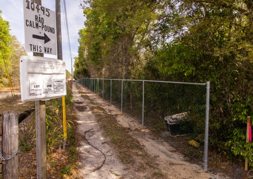 On Top of the World erected this chain-link fence on the border with Robbie Delli-Veneri's land.