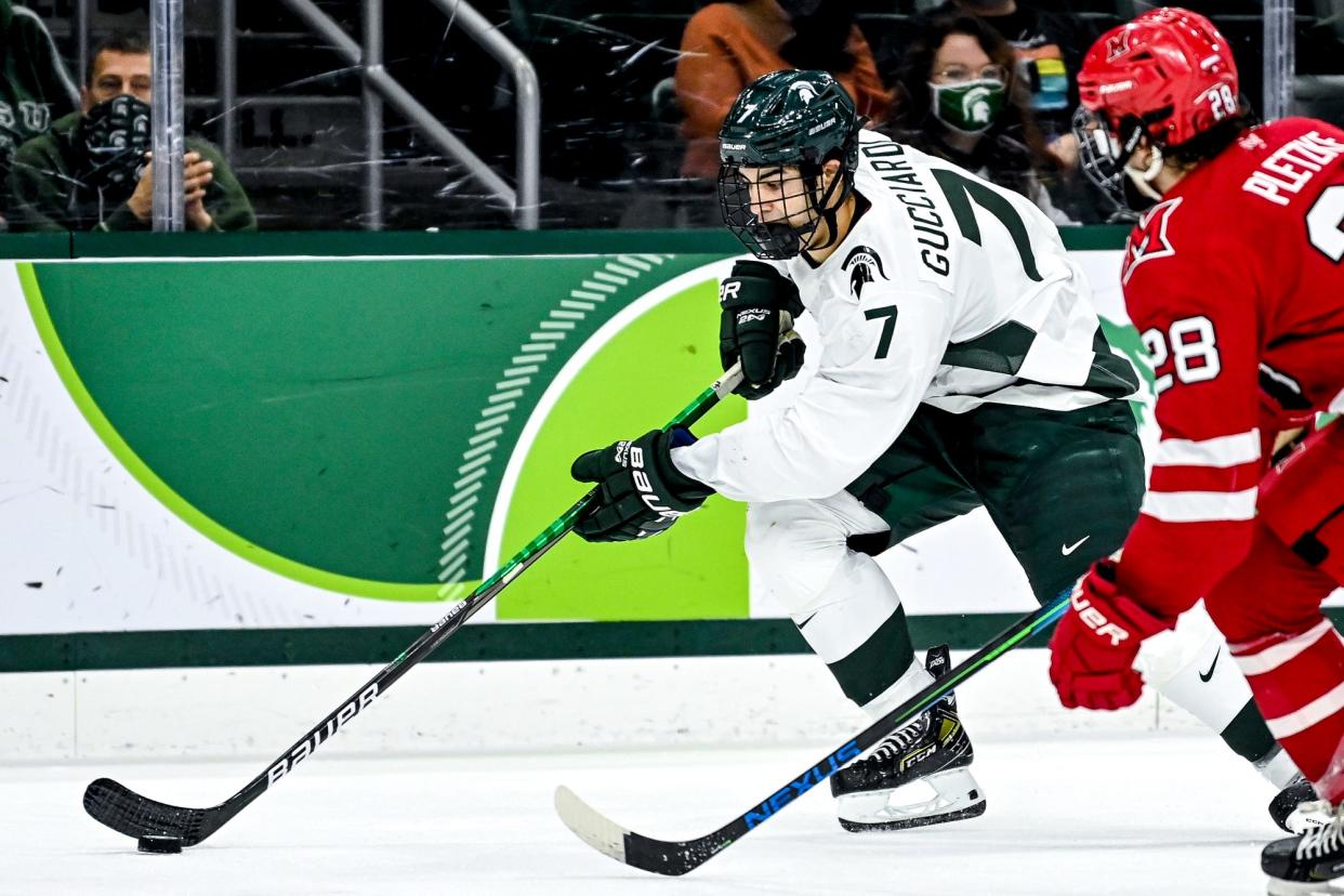 Michigan State sophomore defenseman David Gucciardi, left, shown during a game last season against Miami, is expected to be in the lineup for the first time this season when the Spartans host UMass-Lowell for two games this weekend at Munn Arena.