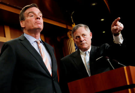 FILE PHOTO -- Senate Intelligence Committee Chairman Sen. Richard Burr (R-NC), accompanied by Senator Mark Warner (D-VA), vice chairman of the committee, speaks at a news conference to discuss their probe of Russian interference in the 2016 election on Capitol Hill in Washington, D.C., U.S., March 29, 2017. REUTERS/Aaron P. Bernstein/File Photo