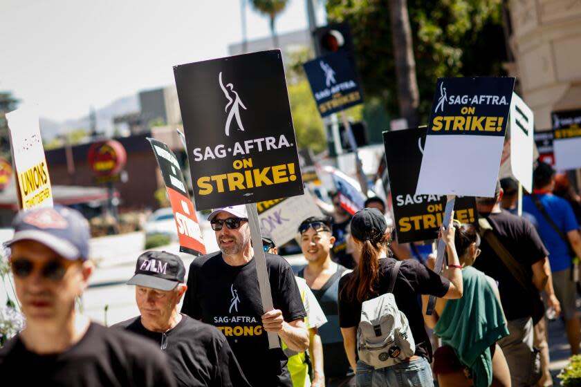 Burbank, CA - July 14: Members of the Screen Actors Guild - American Federation of Television and Radio Artists (SAG-AFTRA), joined members of the Writers Guild of America (WGA), picketing outside the Warner Bros. studio Lot, in Burbank, CA, Friday, July 14, 2023. (Jay L. Clendenin / Los Angeles Times)