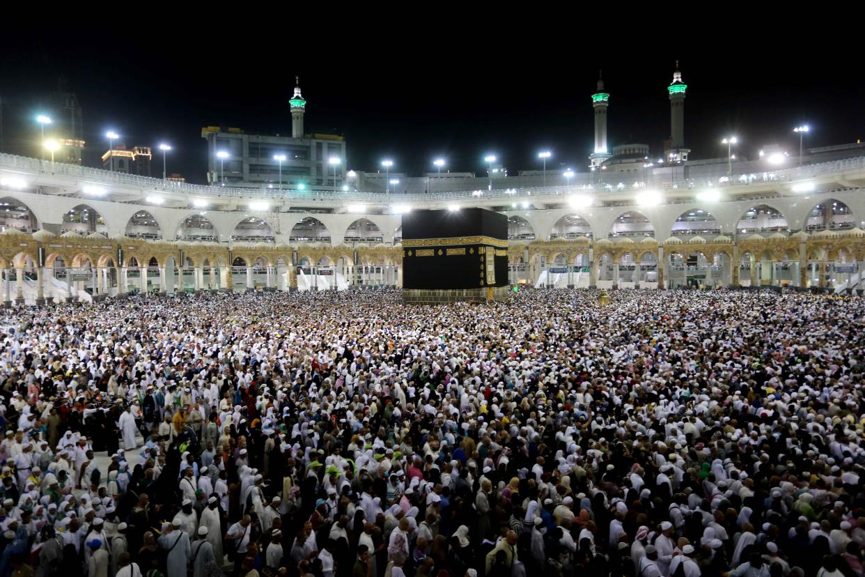 MECCA, SAUDI ARABIA - AUGUST 14: Muslim pilgrims circumambulate the Kaaba, Islam's holiest site, located in the center of the Masjid al-Haram, Saudi Arabia on August 14, 2019, after stoning the Jamarat pillars that symbolize the devil as a part of the annual Islamic Hajj pilgrimage.   (Photo by Ashraf Amra/Anadolu Agency via Getty Images)