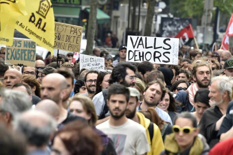 A protestor carries a sign reading "Valls out" during a demonstration against proposed government labour and employment law reforms in Toulouse