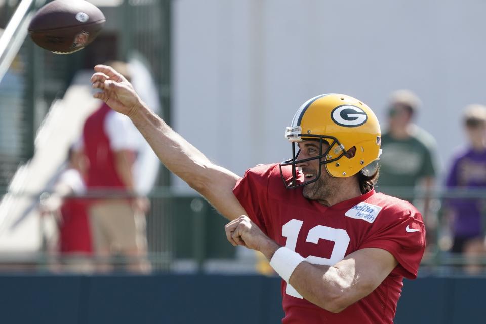 Green Bay Packers' Aaron Rodgers runs a drill before an NFL football joint practice session with the New Orleans Saints Tuesday, Aug. 16, 2022, in Green Bay, Wis. (AP Photo/Morry Gash)