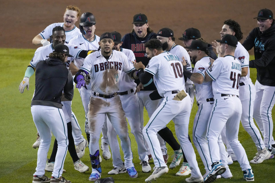 Arizona Diamondbacks' Ketel Marte (4) celebrates his walk off single against the Philadelphia Phillies during the ninth inning in Game 3 of the baseball NL Championship Series in Phoenix, Thursday, Oct. 19, 2023. (AP Photo/Rick Scuteri)