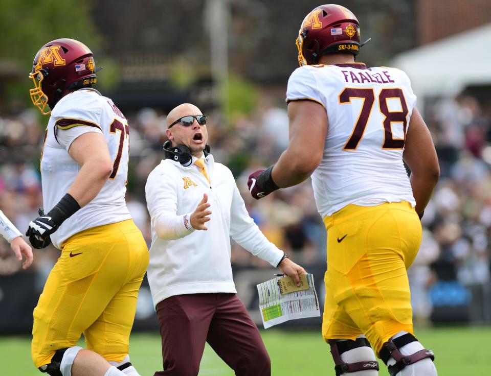 Sep 28, 2019; West Lafayette, IN, USA;  Minnesota Gophers head coach P.J. Fleck celebrates a touchdown with lineman Daniel Faalele (78) in the first half against the Purdue Boilermakers at Ross-Ade Stadium. Mandatory Credit: Thomas J. Russo-USA TODAY Sports