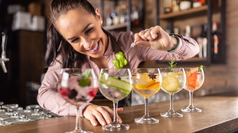 bartender garnishing drinks