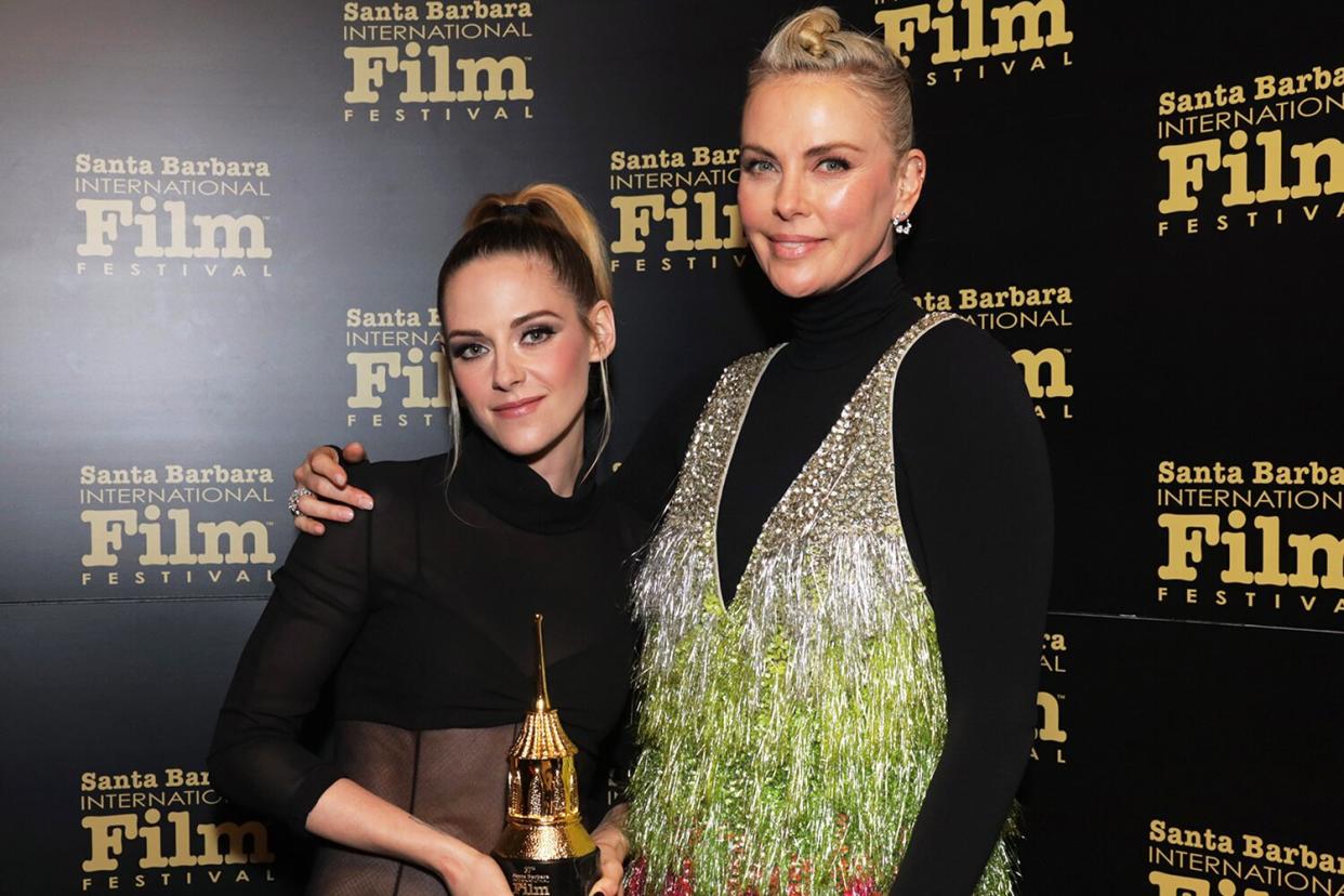 Kristen Stewart, with her American Riviera Award, and Charlize Theron attend the American Riviera Award tribute during the 37th Annual Santa Barbara International Film Festival at Arlington Theatre on March 04, 2022 in Santa Barbara, California.