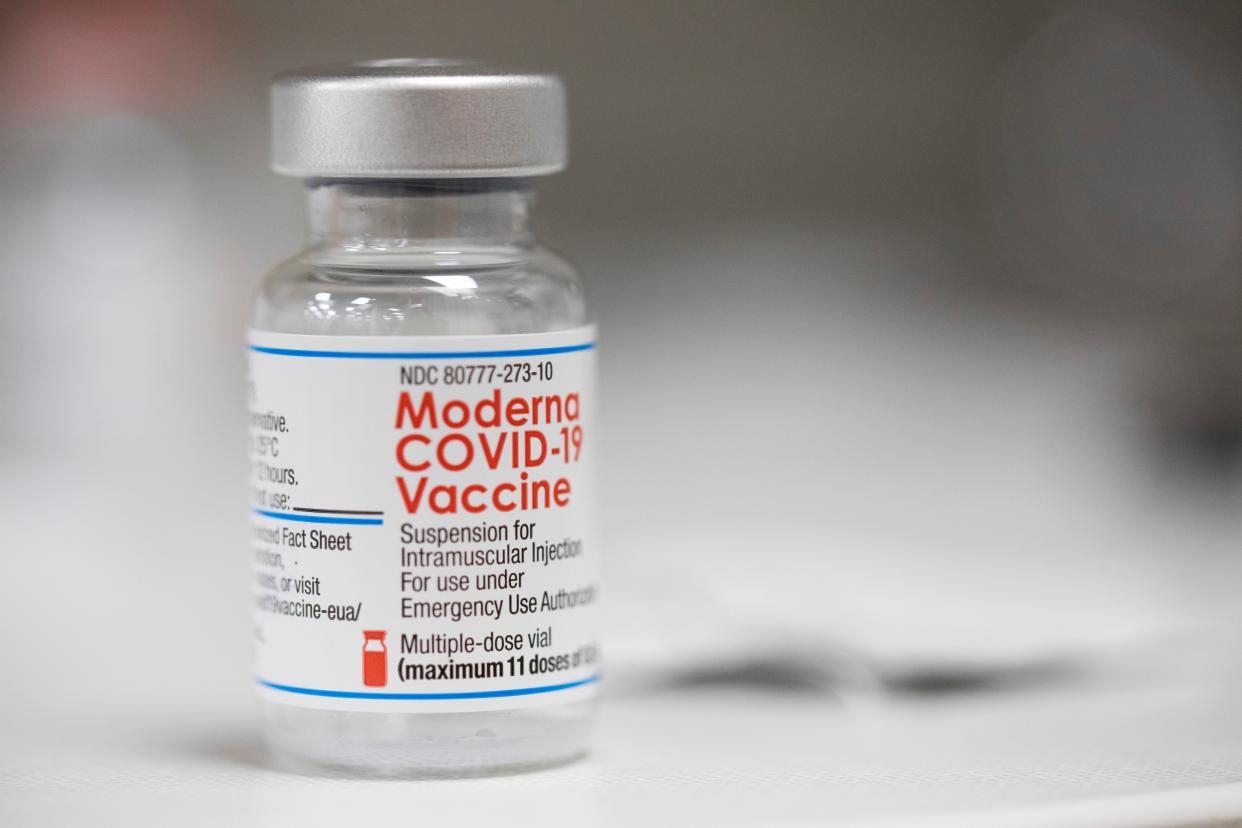 A vial of the Moderna COVID vaccine is seen on a pharmacy counter in Portland, Ore., last December.