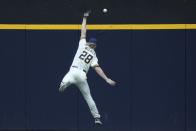 Milwaukee Brewers' Joey Wiemer can't catch a double hit by Chicago Cubs' Dansby Swanson during the second inning of a baseball game Monday, July 3, 2023, in Milwaukee. (AP Photo/Morry Gash)